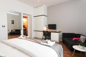 a hotel room with a large bed and a large mirror at Prima Luxury Rooms in Split