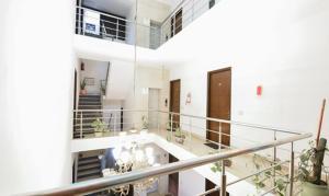 a view of a building with stairs and plants at The Hotel Am Bliss in Gurgaon