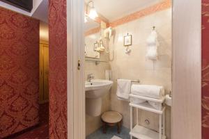 a bathroom with a sink and a toilet in a room at Ca' Della Loggia in Venice +63 photos
