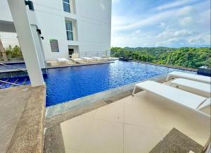 a swimming pool in the middle of a building at Threeos Cabana in Boracay