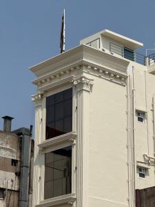 a building with a large window on top of it at The Grand Sarayu in Mysore