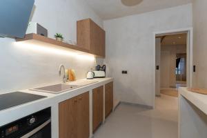 a kitchen with a sink and a counter top at Bosi Suites 2 in Zakynthos