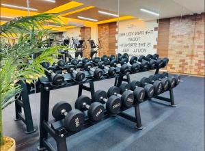 a row of dumbbell racks in a gym at Threeos Cabana in Boracay