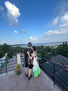 a man and a woman standing on top of a building at Lake Edge Resort in Anuradhapura
