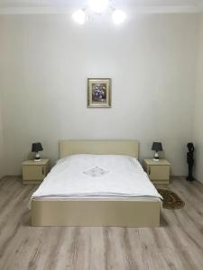 Un ou plusieurs lits dans un hébergement de l'établissement Batumi Summer Hotel