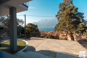 a view of a lake from a house at SYMPHONY HOUSE by Design Studio in Bellano