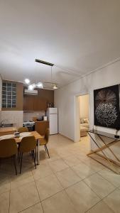 a kitchen and dining room with a table and chairs at City Comfort Sparti in Sparta