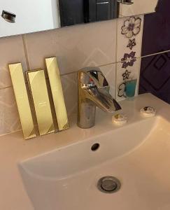 a sink with a faucet on top of it at جميــرا لاين in Abha