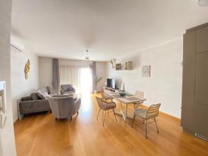 a living room with a couch and a table at Przno central seaside in Pržno +20 photos