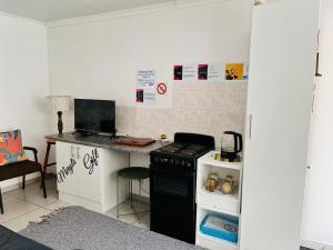 a kitchen with a stove and a counter top at Covenant Place in Cape Town