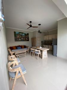 a living room with a couch and a table at the gosana in Amed