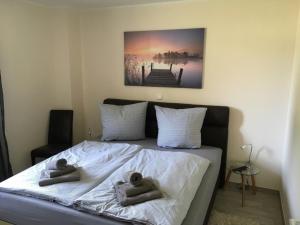 two babies laying on a bed in a bedroom at Kerstin in Lenz +4 photos
