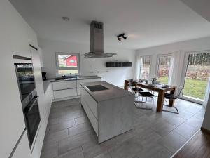 a kitchen with a table and a counter top at Seemöwe in Lenz
