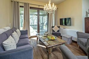 a living room with a couch and a table at Ben in Lenz