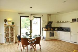 a kitchen and dining room with a table and chairs at Werner in Lenz