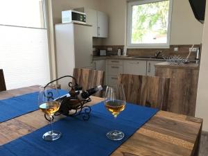 a table with two glasses of wine on it at Edith in Lenz