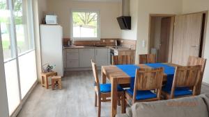 a kitchen and dining room with a table and chairs at Edith in Lenz