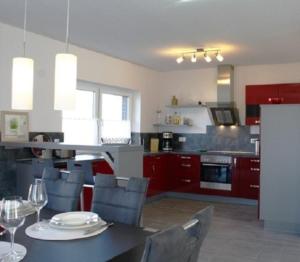 a kitchen and dining room with a table and chairs at Valentina in Lenz