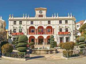a large building with a clock tower on top of it at Studio Nova in Priego de Córdoba