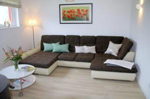 a living room with a couch and a table at Trine in Lenz