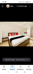 a screenshot of a bedroom with a bed at AB Merridien in Coimbatore