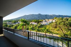 a balcony with a view of the mountains at Hotel Crystal in Orebić