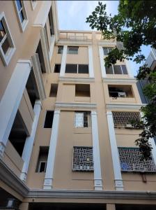 a tall building with windows and balconies at Hum Homes - Urban Abode in Hyderabad