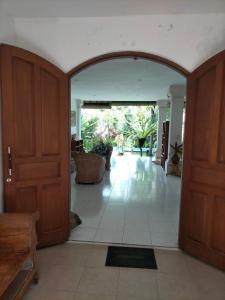 an entrance to a room with an open door at Sang Fajar Ubud in Ubud