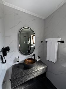 a bathroom with a sink and a mirror at Spa&Hotel Studenac in Trebinje