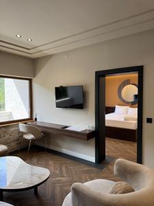 a hotel room with a bed and a mirror at Spa&Hotel Studenac in Trebinje +17 photos