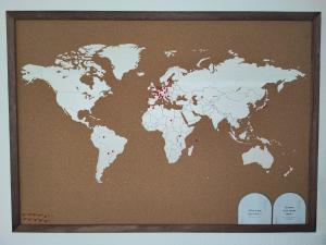 a map of the world on a brown clipboard at L'escapade d'Henry Dunant in Épernay