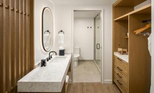 a bathroom with a sink and a toilet at Guesthouse Hotel at La Valle in Rancho Santa Fe