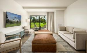 a living room with a couch and a table at Guesthouse Hotel at La Valle in Rancho Santa Fe +68 photos