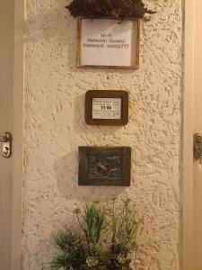 a wall with a plaque on it with a sign on it at In House in Tbilisi City +18 photos