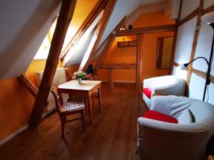 a living room with a couch and a table at Haus Seenland in Feldberg