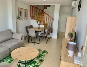 a living room with a couch and a table at Casa Teuwisse in Torre-Pacheco
