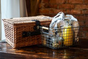 a basket sitting on top of a wooden table at Novosiele Residence - nad górską rzeką - Leśne Spa sauna jacuzzi - Bieszczady in Bystre