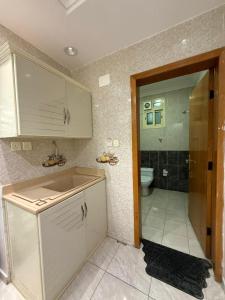 a bathroom with a sink and a toilet in it at فيو المنسك in Abha +38 photos