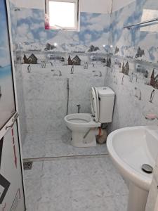 a bathroom with a toilet and a sink at Home stray 7 in Matara +10 photos