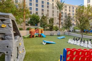 a playground with a large building in the background at Club Wyndham Grand Desert in Las Vegas