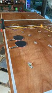 a ping pong table with tools on top of it at La casa de ito in La Chorrera