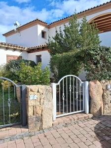 a gate in front of a house at Casamare Roby in Tanaunella