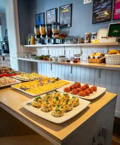 a buffet with different types of food on a table at Willa Anna in Jastarnia