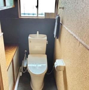a small bathroom with a white toilet with a window at HOTTOSTAYKiyosu in Nagoya +16 photos