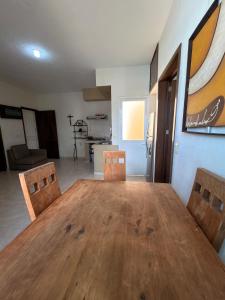 a dining room with a wooden table and chairs at 20 minutes from Chapala, Pool &Grill in Buenavista