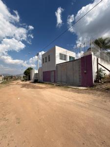 a building on the side of a dirt road at 20 minutes from Chapala, Pool &Grill in Buenavista