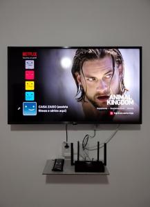 a flat screen tv hanging on a wall at Casa Zago 2 in Santa Maria Madalena