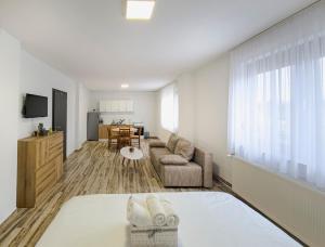 a living room with a bed and a couch at House Mila in Korenica