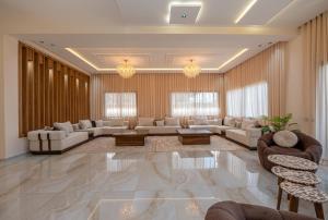 a large living room with couches and chairs at Villa Soliya 4 Rooms with private pool in Marrakesh +49 photos