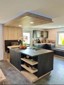 a kitchen with a large island in the middle at Molers in Stühlingen